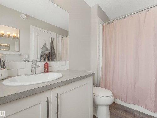 Bathroom with a vanity featuring a white oval sink and a light gray countertop - 725 36 Street, Edmonton, AB - Indoor Photo Showing Bathroom