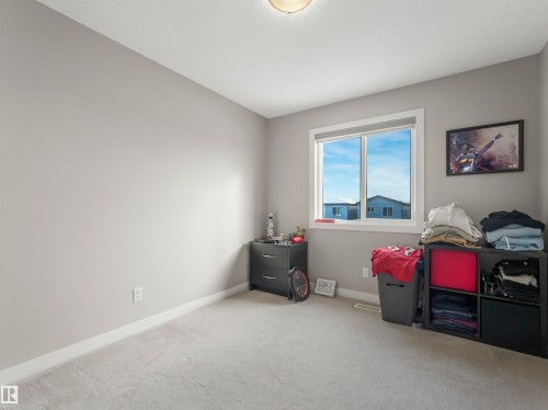 This room features light grey walls and light grey carpet - 725 36 Street, Edmonton, AB - Indoor