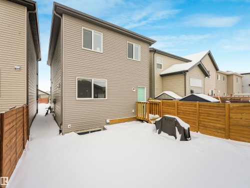The property features a private fenced yard with a wooden deck - 725 36 Street, Edmonton, AB - Outdoor With Exterior