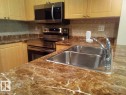 113 616 Mcallister Loop, Edmonton, AB  - Indoor Photo Showing Kitchen With Double Sink 