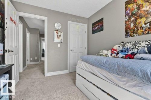 Bedroom with light gray walls, white trim, and light-colored carpeting - 40 14621 121 Street, Edmonton, AB - Indoor Photo Showing Bedroom