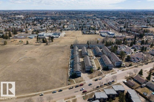 Aerial perspective showcasing a residential community with townhomes and detached properties - 40 14621 121 Street, Edmonton, AB - Outdoor With View