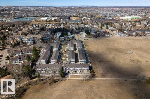 Aerial perspective showcasing a large residential area with multiple housing types - 40 14621 121 Street, Edmonton, AB - Outdoor With View