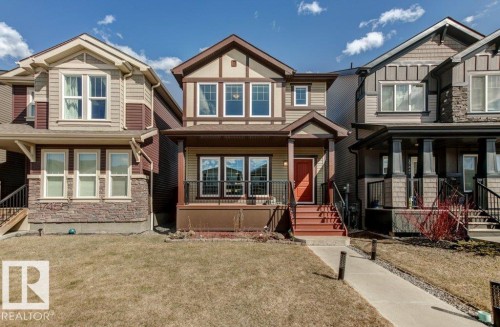 Contemporary detached residence featuring a multi-toned exterior with stone and siding accents - 17451 77 Street, Edmonton, AB - Outdoor With Facade