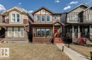 Contemporary detached residence featuring a multi-toned exterior with stone and siding accents - 17451 77 Street, Edmonton, AB  - Outdoor With Facade 