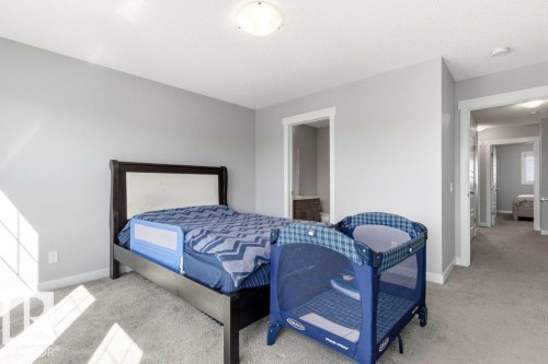 Bedroom featuring light gray walls, plush gray carpeting, white trim, and a ceiling-mounted light fixture - 17451 77 Street, Edmonton, AB - Indoor Photo Showing Bedroom