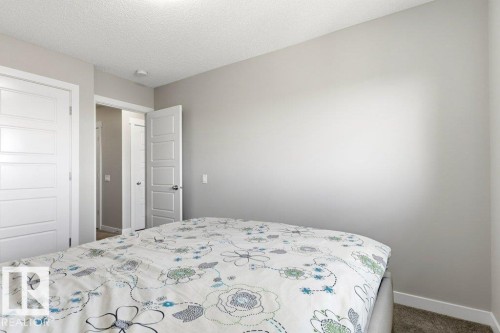Light gray painted walls and textured ceiling - 17451 77 Street, Edmonton, AB - Indoor Photo Showing Bedroom