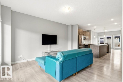 Open-concept main living area with light wood-finish flooring - 17451 77 Street, Edmonton, AB - Indoor