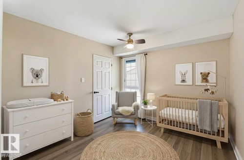 Room featuring warm neutral wall tones and wood-finish flooring - 5740 172 Street, Edmonton, AB - Indoor Photo Showing Bedroom