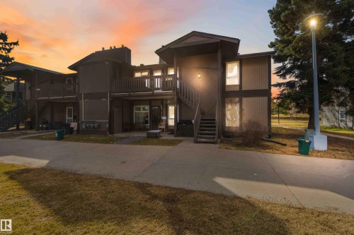 Multi-level exterior featuring balconies, exposed staircases, and contrasting siding with visible windows - 5740 172 Street, Edmonton, AB - Outdoor