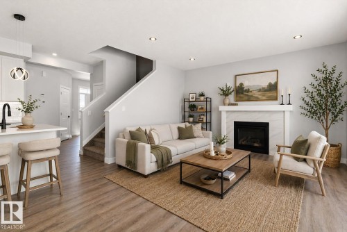 76 Maple Crescent, Gibbons, AB - Indoor Photo Showing Living Room With Fireplace