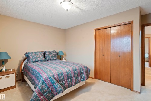 Carpeted room with a ceiling-mounted light fixture - 9831 158 Avenue, Edmonton, AB - Indoor Photo Showing Bedroom