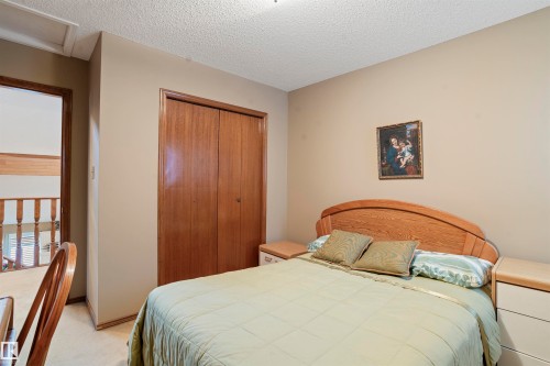 Bedroom with neutral wall color and textured ceiling - 9831 158 Avenue, Edmonton, AB - Indoor Photo Showing Bedroom