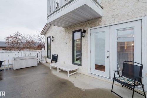 Private patio space with textured stucco exterior - 9831 158 Avenue, Edmonton, AB - Outdoor With Exterior