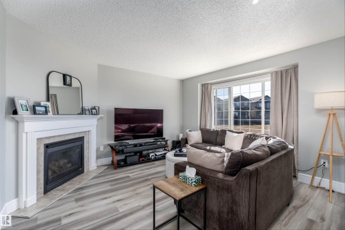 85 Sunrose Lane, Leduc, AB - Indoor Photo Showing Living Room With Fireplace