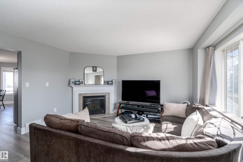 85 Sunrose Lane, Leduc, AB - Indoor Photo Showing Living Room With Fireplace