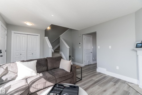 85 Sunrose Lane, Leduc, AB - Indoor Photo Showing Living Room With Fireplace