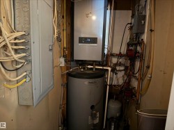 The property includes a water heater and a wall-mounted boiler system - 