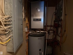 The property includes a water heater and an electrical panel, showcasing essential utilities - 
