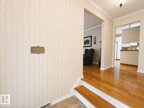 Hardwood flooring throughout entryways and living spaces - 11139 30 Avenue, Edmonton, AB - Indoor Photo Showing Other Room