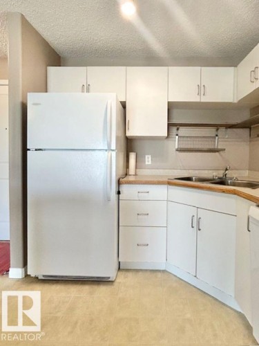 413 11325 83 Street, Edmonton, AB - Indoor Photo Showing Kitchen With Double Sink