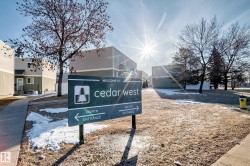 A welcoming sign indicating the "Cedar West" community - 