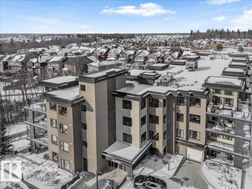 This property features a multi-story building with a modern architectural style, presenting a clean facade with multiple balconies - 211 5029 Edgemont Boulevard, Edmonton, AB - Outdoor With Balcony