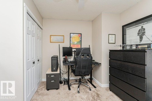 Neutral-toned room featuring a textured ceiling and light-colored walls - 1727 65 Street, Edmonton, AB - Indoor Photo Showing Office