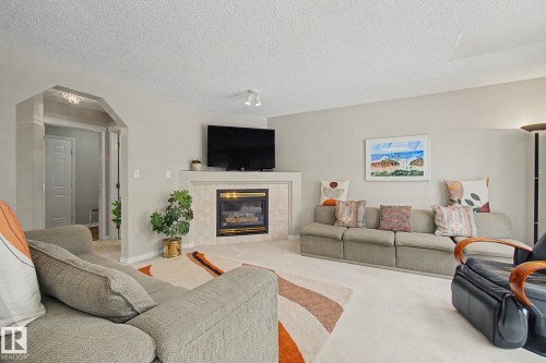 11732 10 Avenue Nw, Edmonton, AB - Indoor Photo Showing Living Room With Fireplace