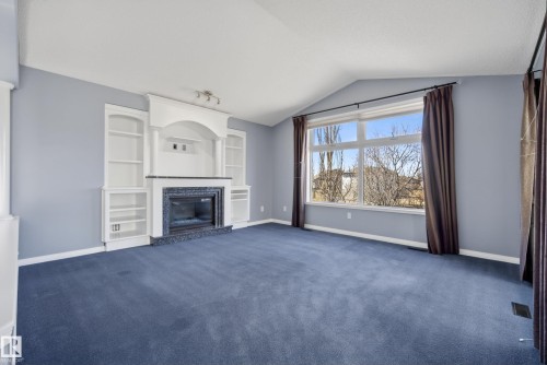 720 87 Street, Edmonton, AB - Indoor Photo Showing Living Room With Fireplace