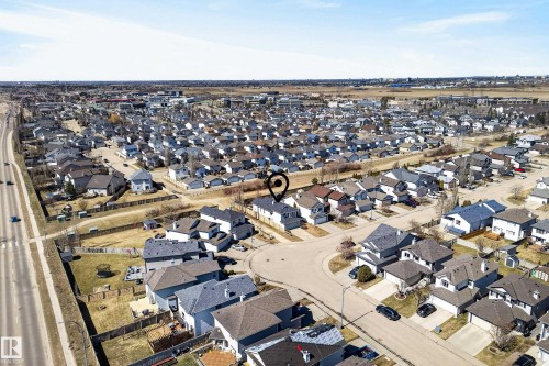 Residential neighborhood featuring a grid-pattern street layout, detached homes with varying roof styles, and a distinct road system - 720 87 Street, Edmonton, AB - Outdoor With View