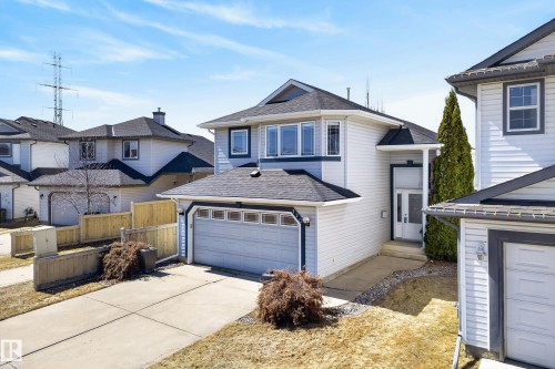 Modern two-story residence featuring light-toned siding and dark trim accents - 720 87 Street, Edmonton, AB - Outdoor