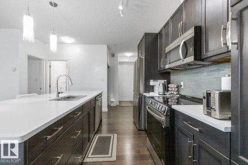 122 320 Ambleside Link Link, Edmonton, AB - Indoor Photo Showing Kitchen With Double Sink With Upgraded Kitchen