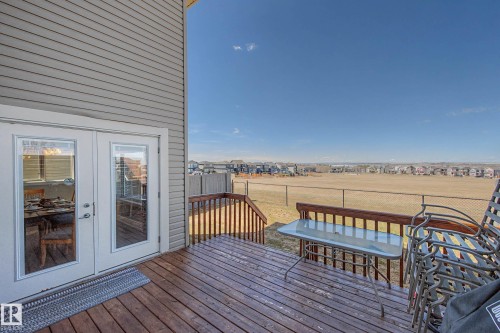 Exterior wood deck featuring a wooden railing and stairs - 2086 Redtail Common, Edmonton, AB - Outdoor With Deck Patio Veranda With Exterior