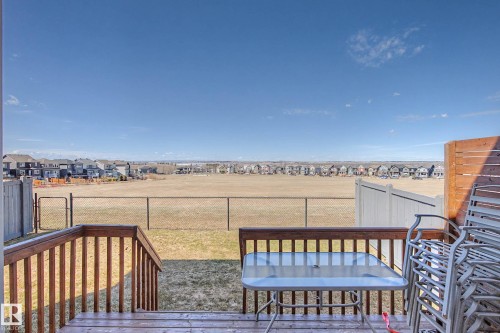 Wood deck with steps down to a fenced yard - 2086 Redtail Common, Edmonton, AB - Outdoor With Deck Patio Veranda