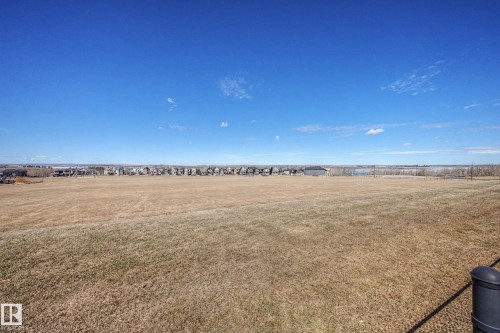 Expansive open field with a clear blue sky overhead - 2086 Redtail Common, Edmonton, AB - Outdoor With View