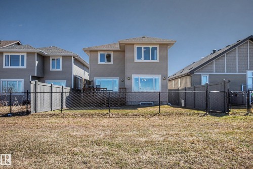 Rear exterior featuring a two-story design with light-colored siding - 2086 Redtail Common, Edmonton, AB - Outdoor