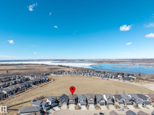 Aerial perspective showcasing residential properties with a water feature and surrounding natural landscape - 2086 Redtail Common, Edmonton, AB - Outdoor With View