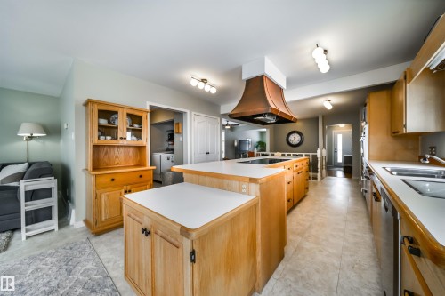 Kitchen featuring light wood cabinetry, light countertops, and tile flooring - 10231 46 Street, Edmonton, AB - Indoor Photo Showing Kitchen