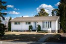 White siding bungalow featuring a bay window with plantation shutters, a gabled roof, and a front walk leading to the entryway - 10231 46 Street, Edmonton, AB  - Outdoor With Facade 