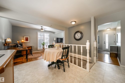 Light-toned floor tiling extending into a space with light gray walls - 10231 46 Street, Edmonton, AB - Indoor Photo Showing Other Room
