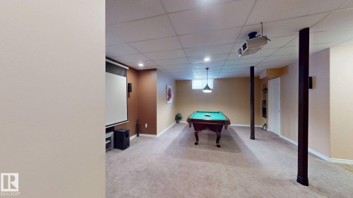 Spacious recreation area featuring carpeting, recessed lighting, and a drop ceiling - 613 Todd Link, Edmonton, AB - Indoor Photo Showing Basement