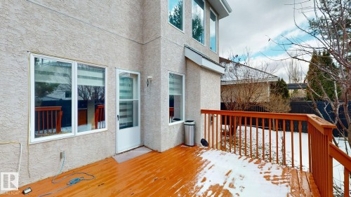 The property features an exterior deck with rich wood flooring and a matching wood railing - 613 Todd Link, Edmonton, AB - Outdoor With Exterior