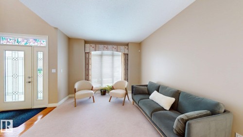 The welcoming entry features a door with decorative glass inserts and a transom window above - 613 Todd Link, Edmonton, AB - Indoor