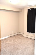Neutral-toned carpet flooring complementing beige wall paint - 