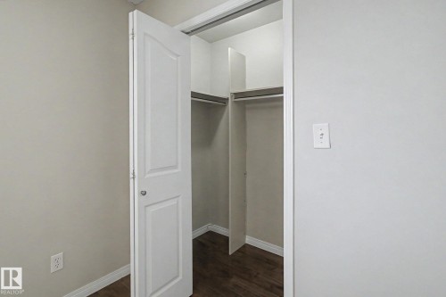 Built-in closet with shelving and hanging rods - 3903 32 Street, Edmonton, AB - Indoor Photo Showing Other Room