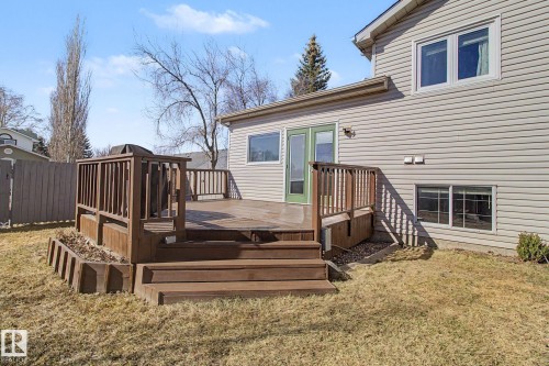 Expansive outdoor deck featuring wood decking and railings, with integrated planters - 3903 32 Street, Edmonton, AB - Outdoor With Deck Patio Veranda With Exterior