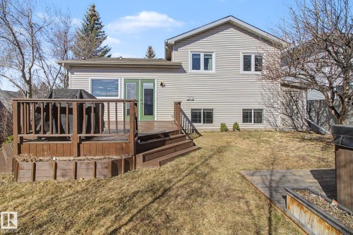 Multi-level wooden deck with integrated planter boxes and stairs - 3903 32 Street, Edmonton, AB - Outdoor