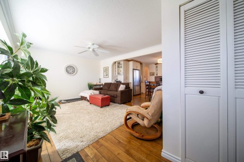 Warm wood-finish flooring complements the neutral wall tones - 8932 154 Street, Edmonton, AB - Indoor