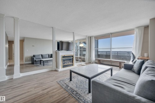 1412 13910 Stony Plain Road, Edmonton, AB - Indoor Photo Showing Living Room With Fireplace